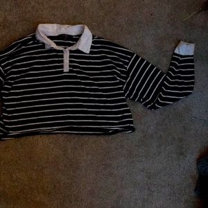 Black and white striped, cropped, collared, long sleeve tee.